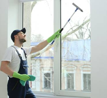 Man Using Tucker Window Cleaning Products